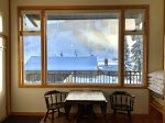 Winter view of pool and Alpine ski area from the living area